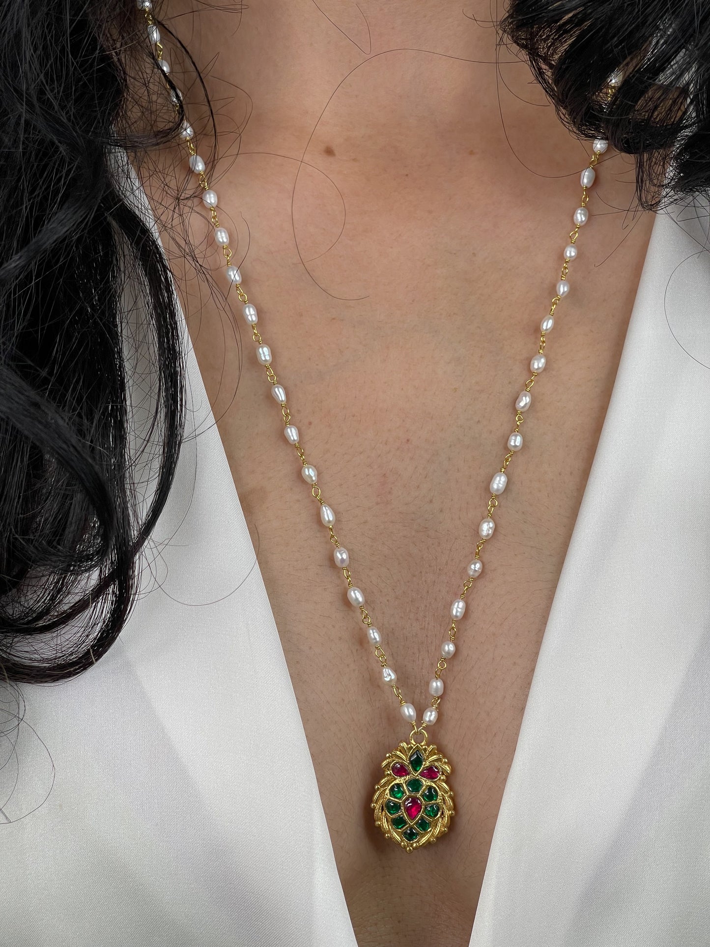 Pearl chain with colour full stone pendant.